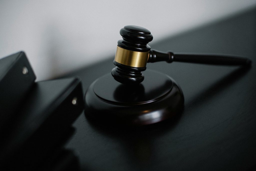 gavel next to folders of documents